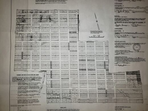 Modern subdivision plat with street grid and lot schedule tables