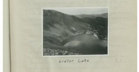 Black and white photograph mounted on a page, hand captioned: Crater Lake
