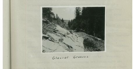 Black and white photograph mounted on a page, hand captioned: Glacial Grooves